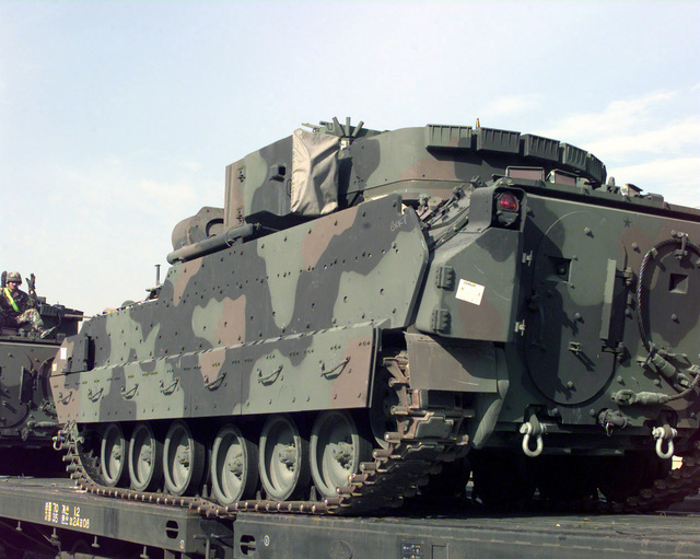 SGT Nara Tith drives a M3/M4 Bradley Infantry Fighting Vehicle onto a ...