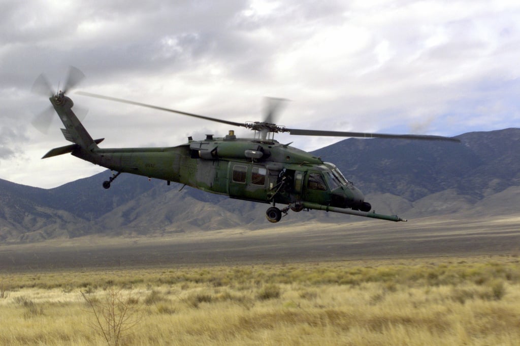 Right side profile medium shot as USAF HH-60 Pavehawk helicopter pilot ...