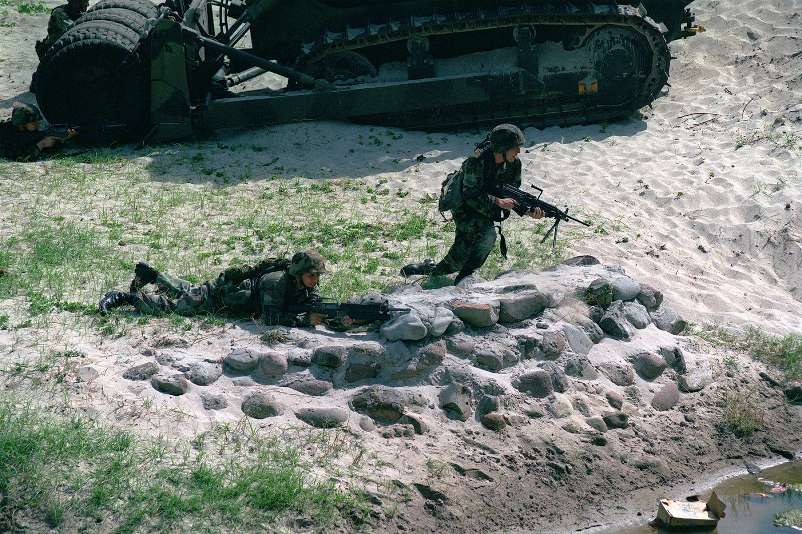 Corporal (CPL) Jason F. Stewart, armed with an M249 Squad Automatic ...