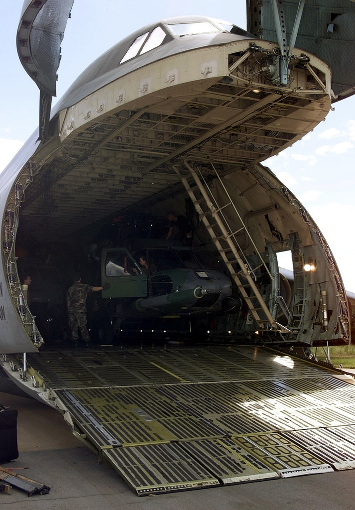 Medium shot, right front view, a parked C-5 Galaxy, nose visor raised ...