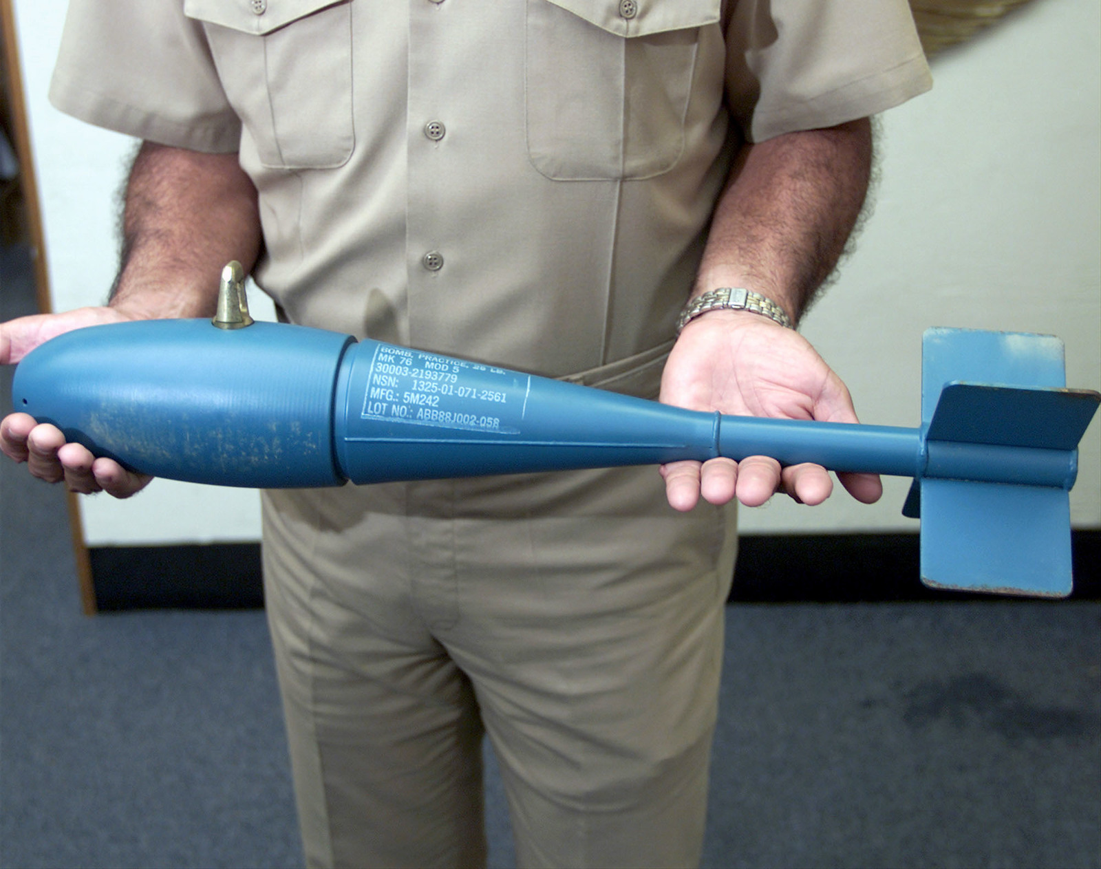 An Unidentified Us Navy Usn Sailor Holds A u 33 B Mk 76 Mod 5 25 Pound Practice Bomb U S National Archives Public Domain Image