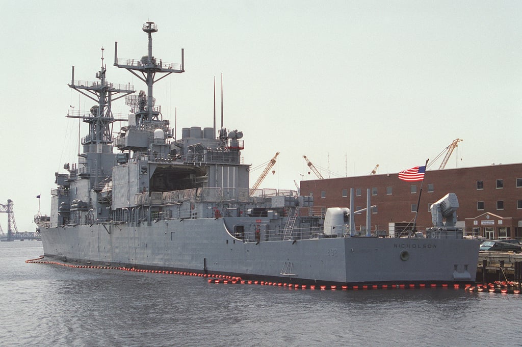 A stern to bow, portside view of the USS NICHOLSON (DD 982), moored at ...