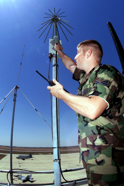 US Air Force SENIOR AIRMAN James Baumgartner checks a control tower ...