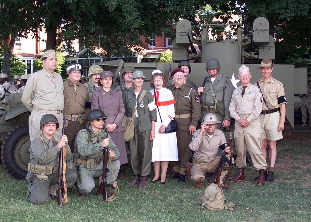 Korean War Re-enactors Pose In Front Of A Korean War Era Tank During ...