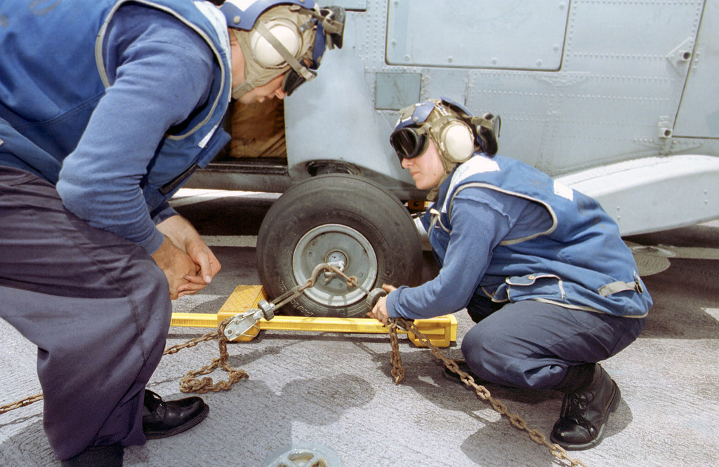 US Navy Engineman 2nd Class Anthony Bartelli (right) holds an