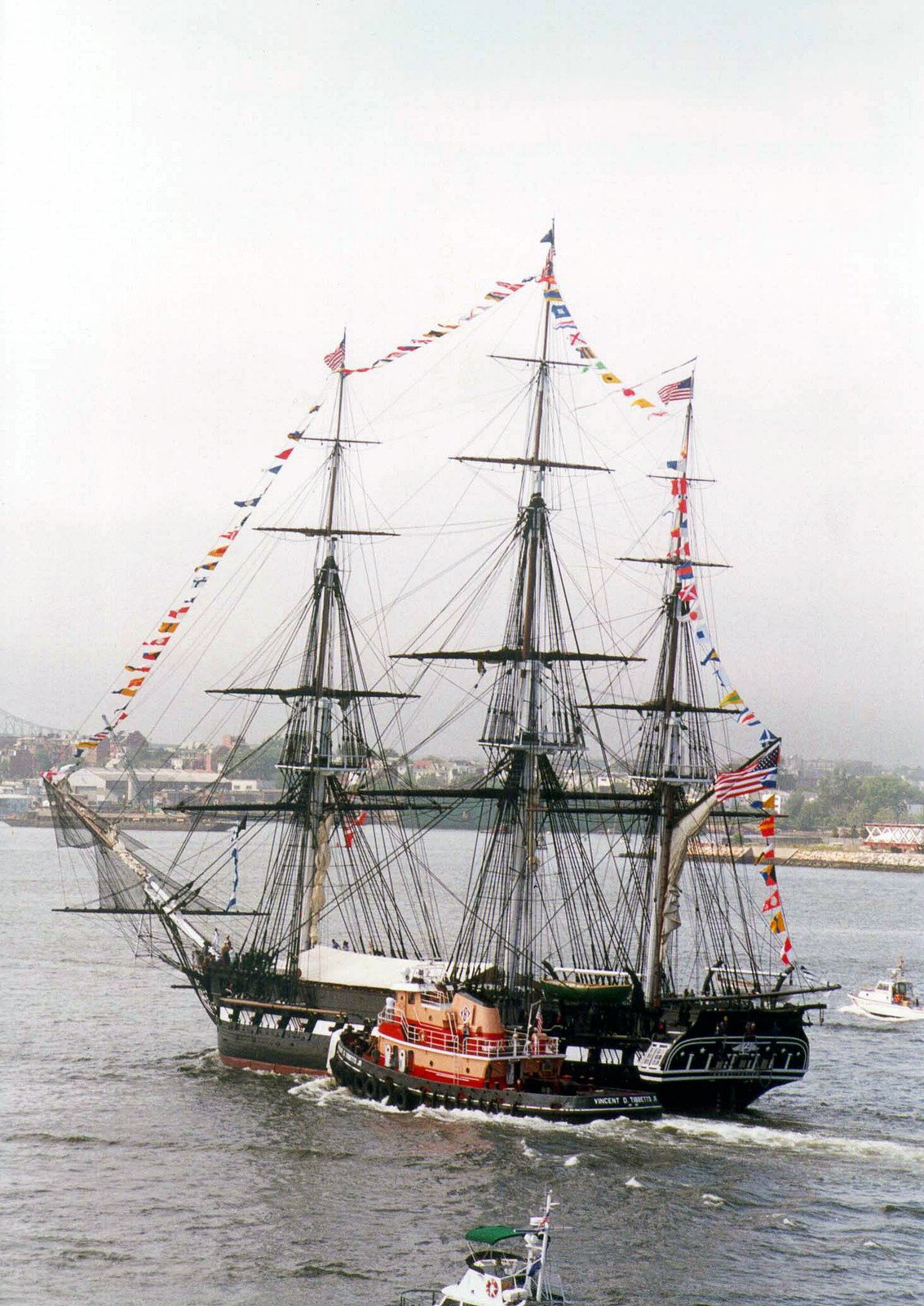 USS CONSTITUTION (Old Ironsides) returns to port after leading the tall ...