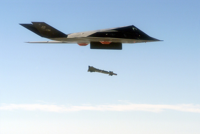 An F-117 Nighthawk engages it's target and drops a GBU-28 guided bomb ...