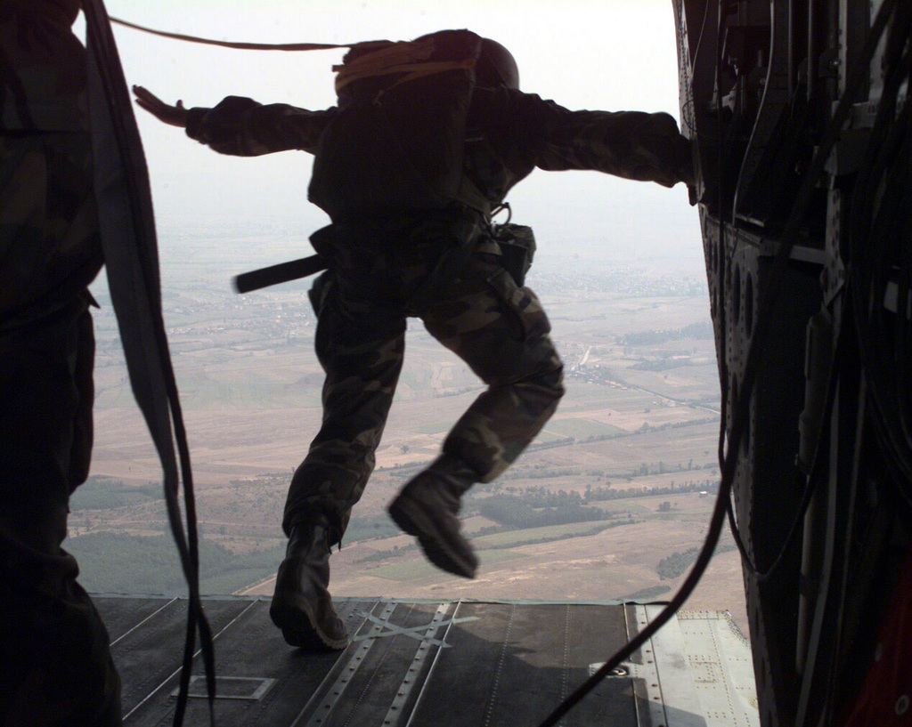 A US Army (USA) Task Force (TF) Falcon Soldier steps out of a USA CH-47 ...