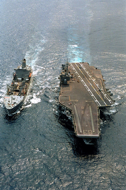 The aircraft carrier USS KITTY HAWK (CV-63), refuels from the USNS ...