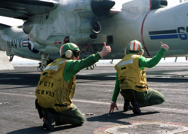 446th AW passes Seahawks' 12th-Man flag to Coast Guard > 446th