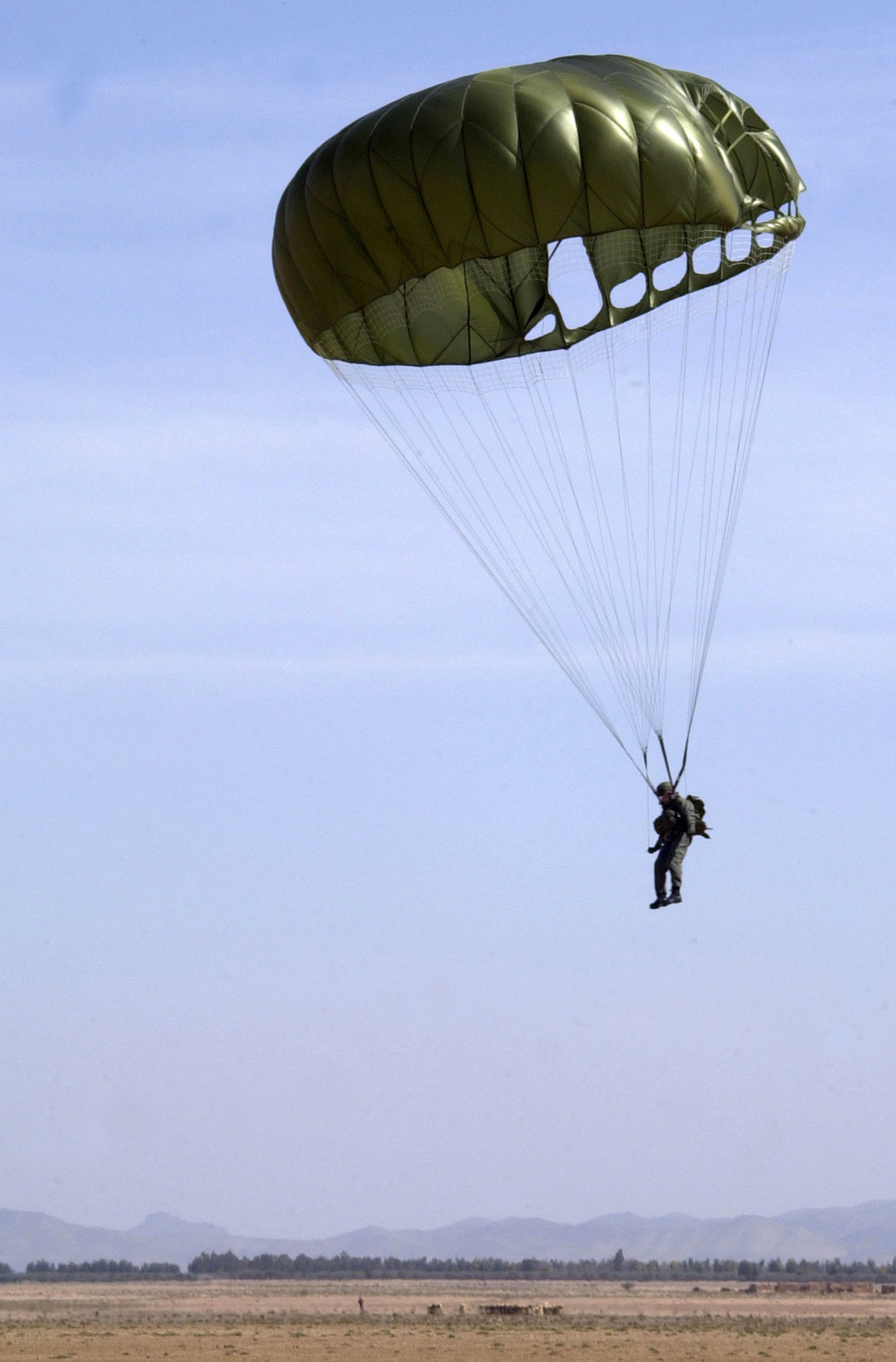 A Moroccan Army paratrooper gets ready to touch ground, during a static ...