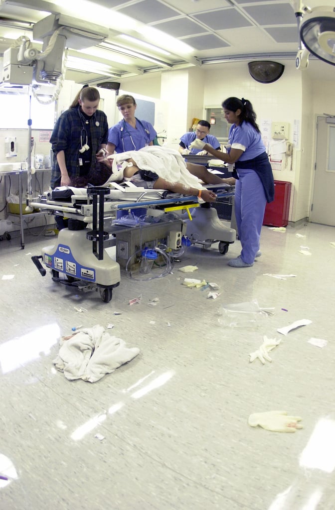 Civilian And Military Medical Personnel Treat A Patient In The Trauma ...