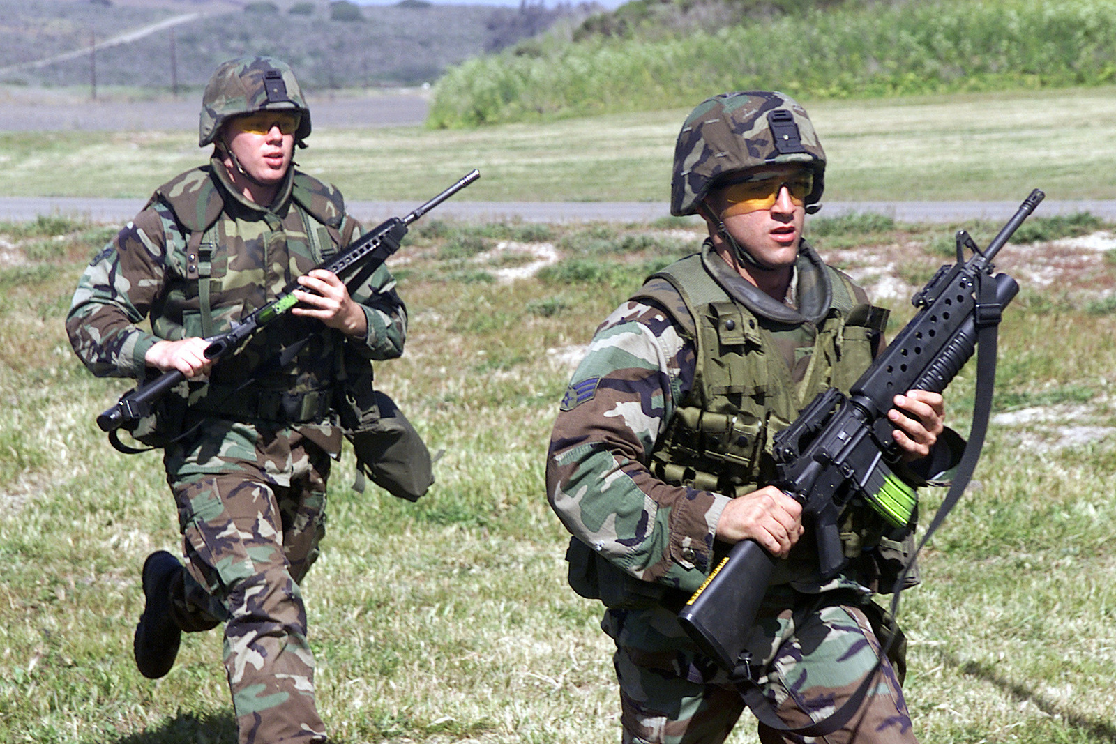 Sior AIRMAN Vinct G. Ouchana, USAF, (right) with a Colt 5.56 mm M16A2 ...