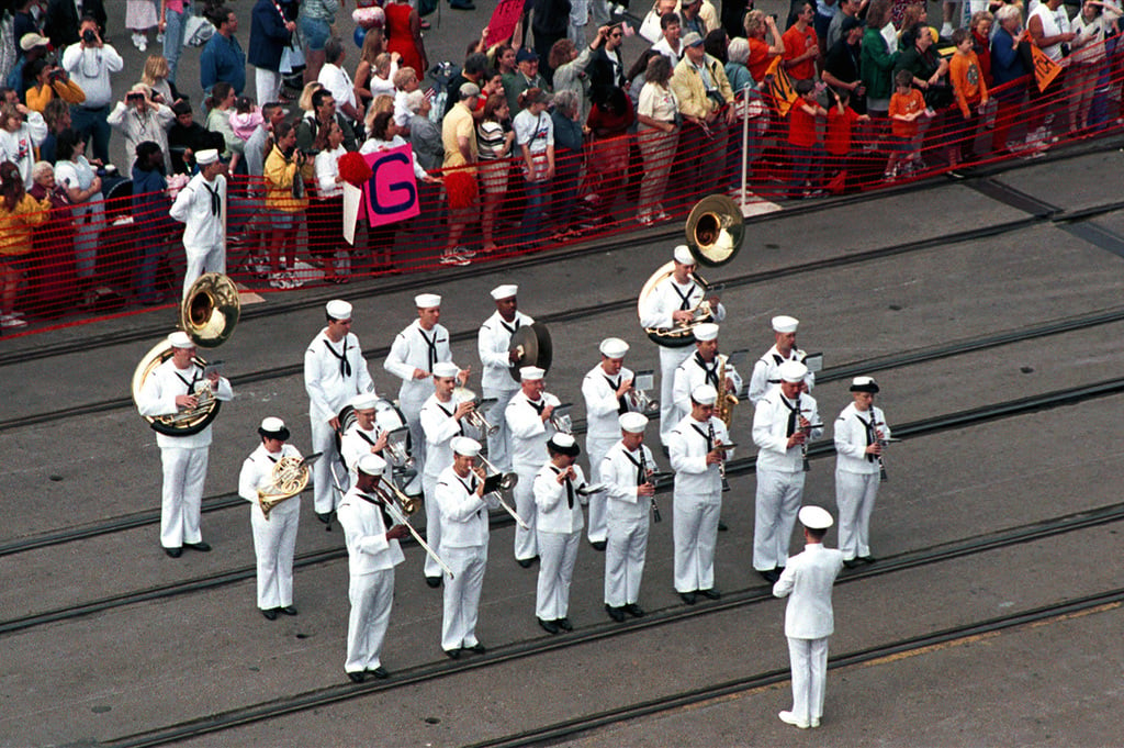 A US Navy band plays for a crowd aboard the aircraft carrier USS HARRY