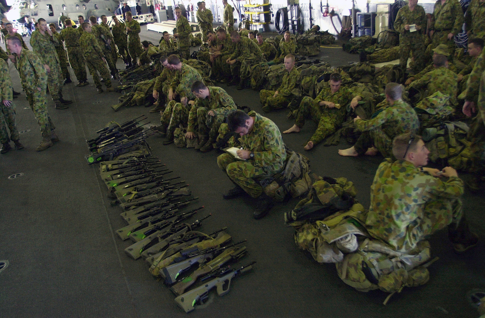 Australian Soldiers From The 2nd Royal Australian Regiment Rar Townsville Australia Rest In The Hangar Deck