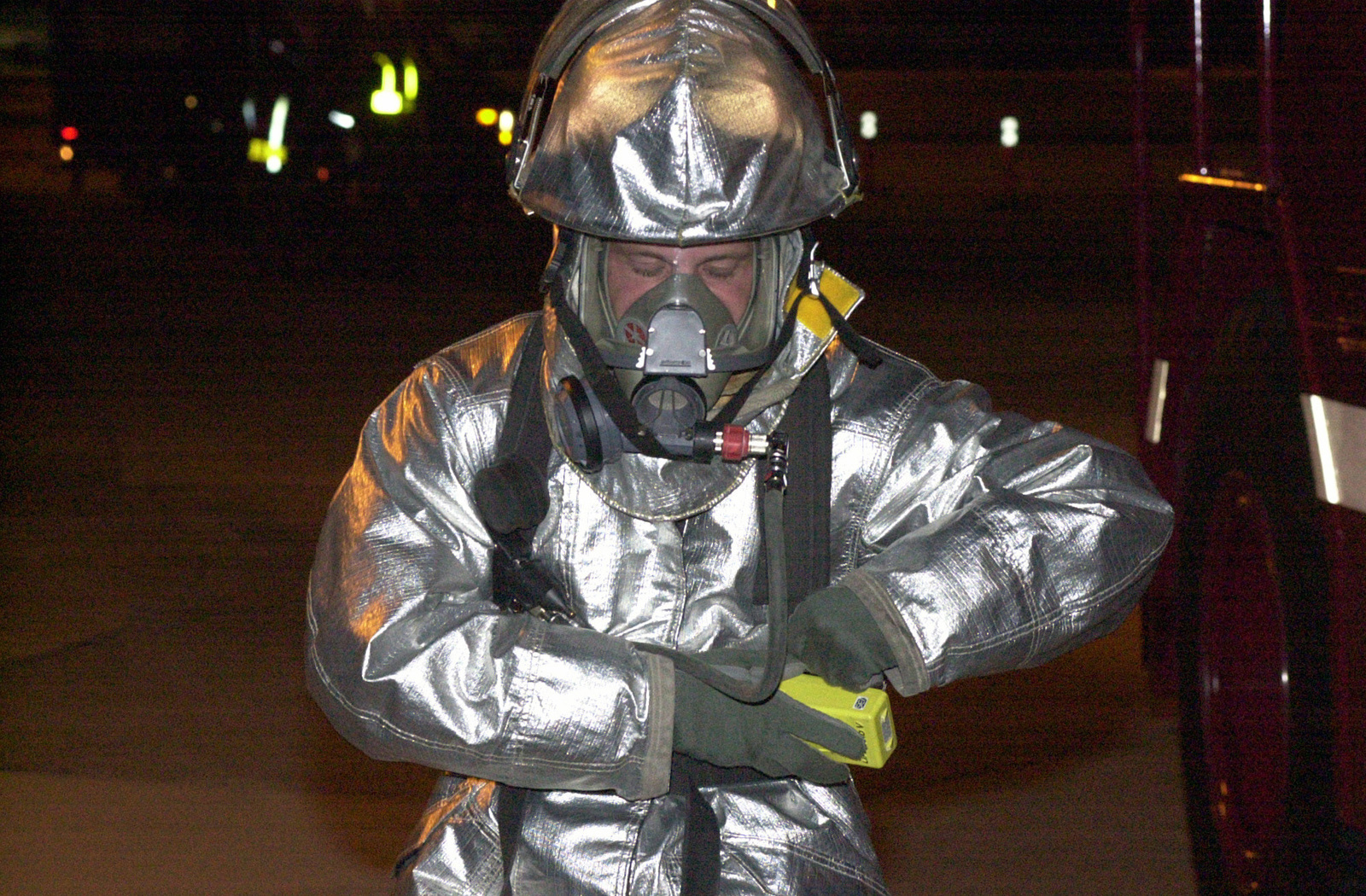 A member of the US Air Force 13th Air Expeditionary Wing, wearing fire ...