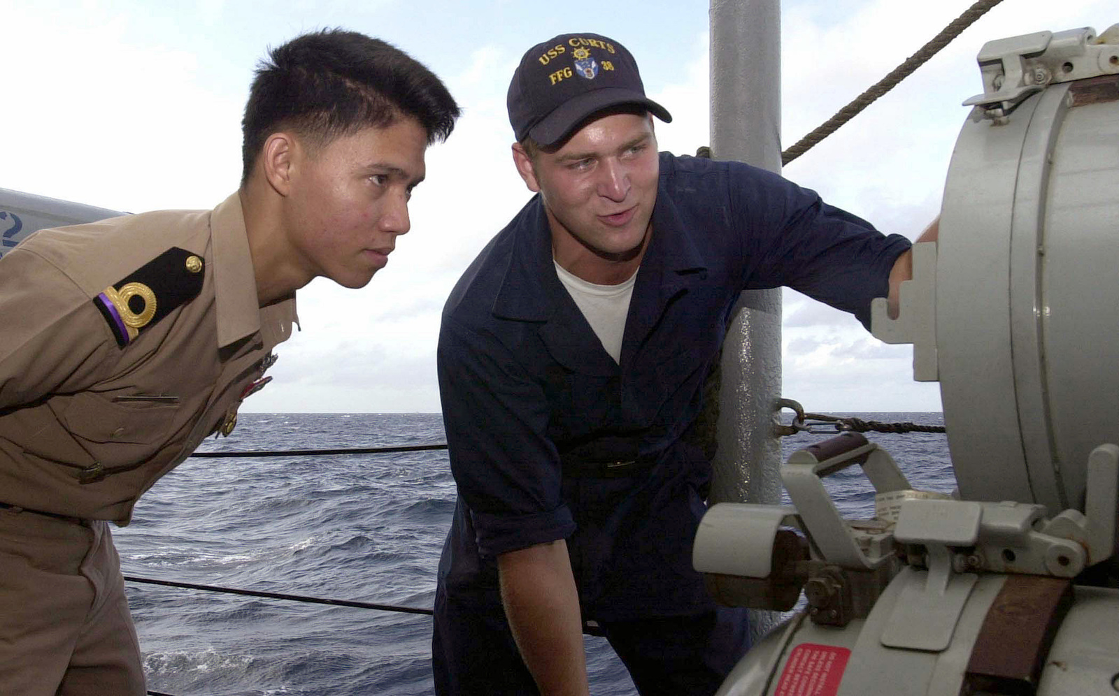 Royal Thai Navy (RTN), ENSIGN (ENS) Jitti Sampattakul (left), and US ...