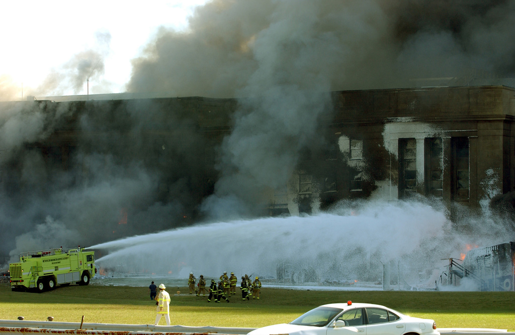 The Pentagon in flames moments after a hijacked jetliner crashed into ...