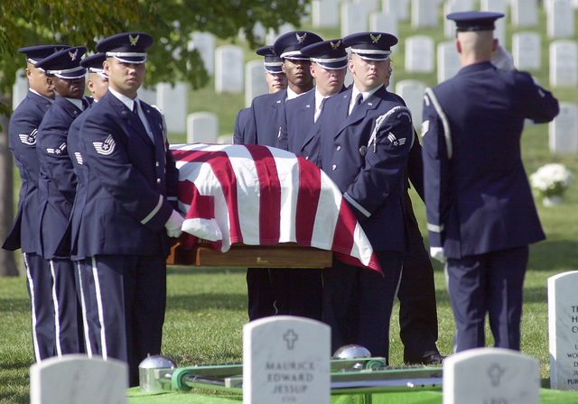 Members of the Air Force Honor Guard bear the remains of MASTER ...