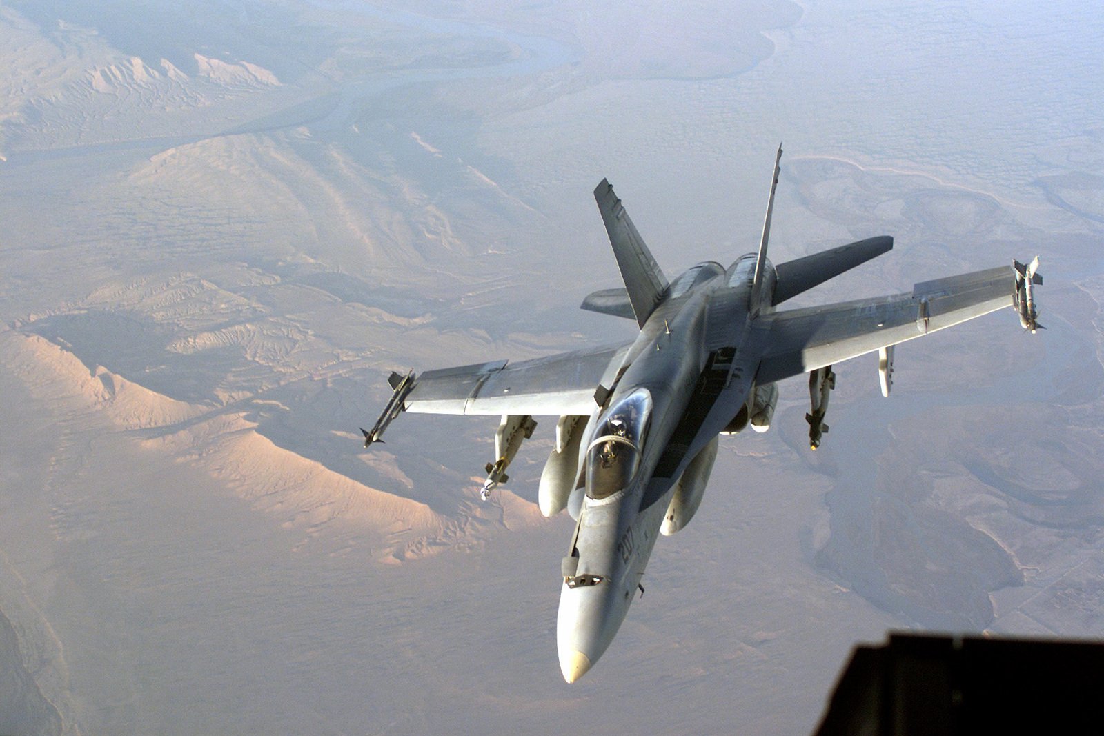 A Navy F/A-18 Hornet, armed with two AIM 9L Sidewinder missiles on the ...