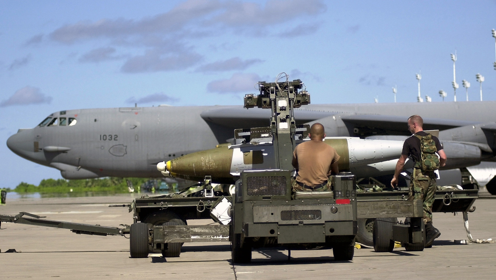 Air Force munitions specialists from the 28th Air Expeditionary Wing use an...