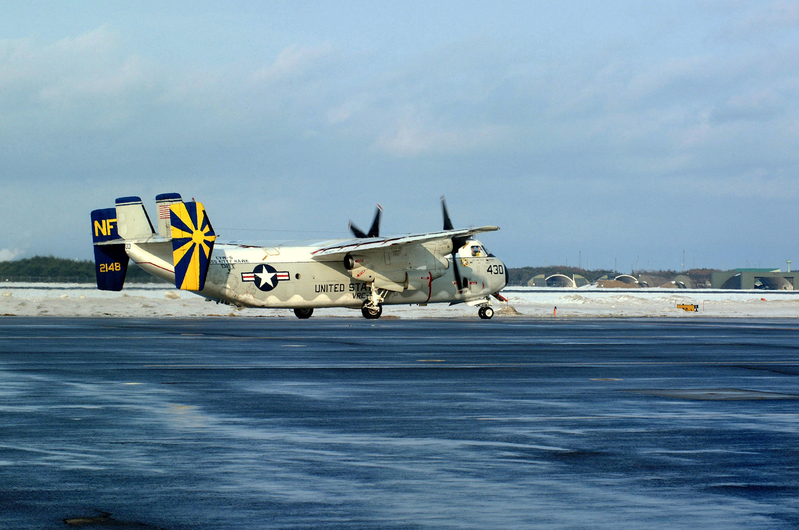 A Us Navy (Usn) C-2A Greyhound, Carrier Onboard Delivery (Cod) Aircraft  Assigned To Carrier Air Wing Five (Cvw-5), Fleet Logistics Support Squadron  30 (Vrc-30), Taxies Down The Runway After Landing At Misawa,