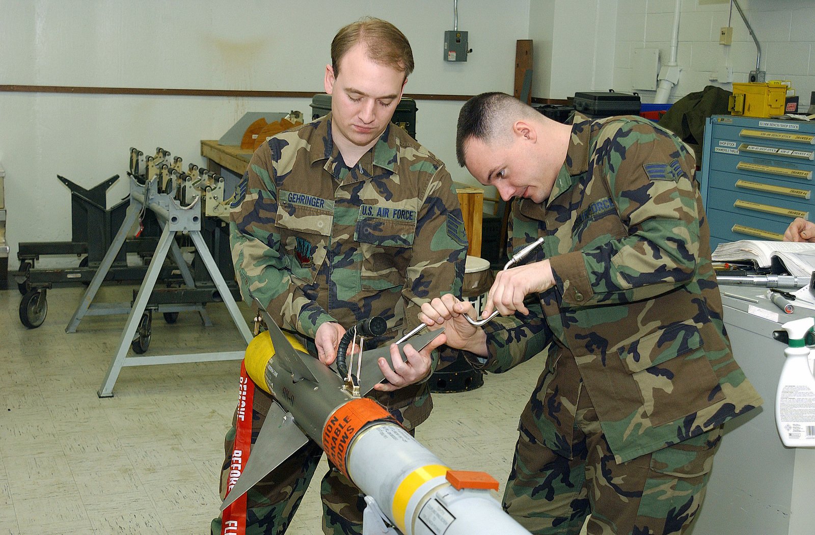 As a team, STAFF Sergeant (SSGT) Mike Gehringer, USAF, and SENIOR ...