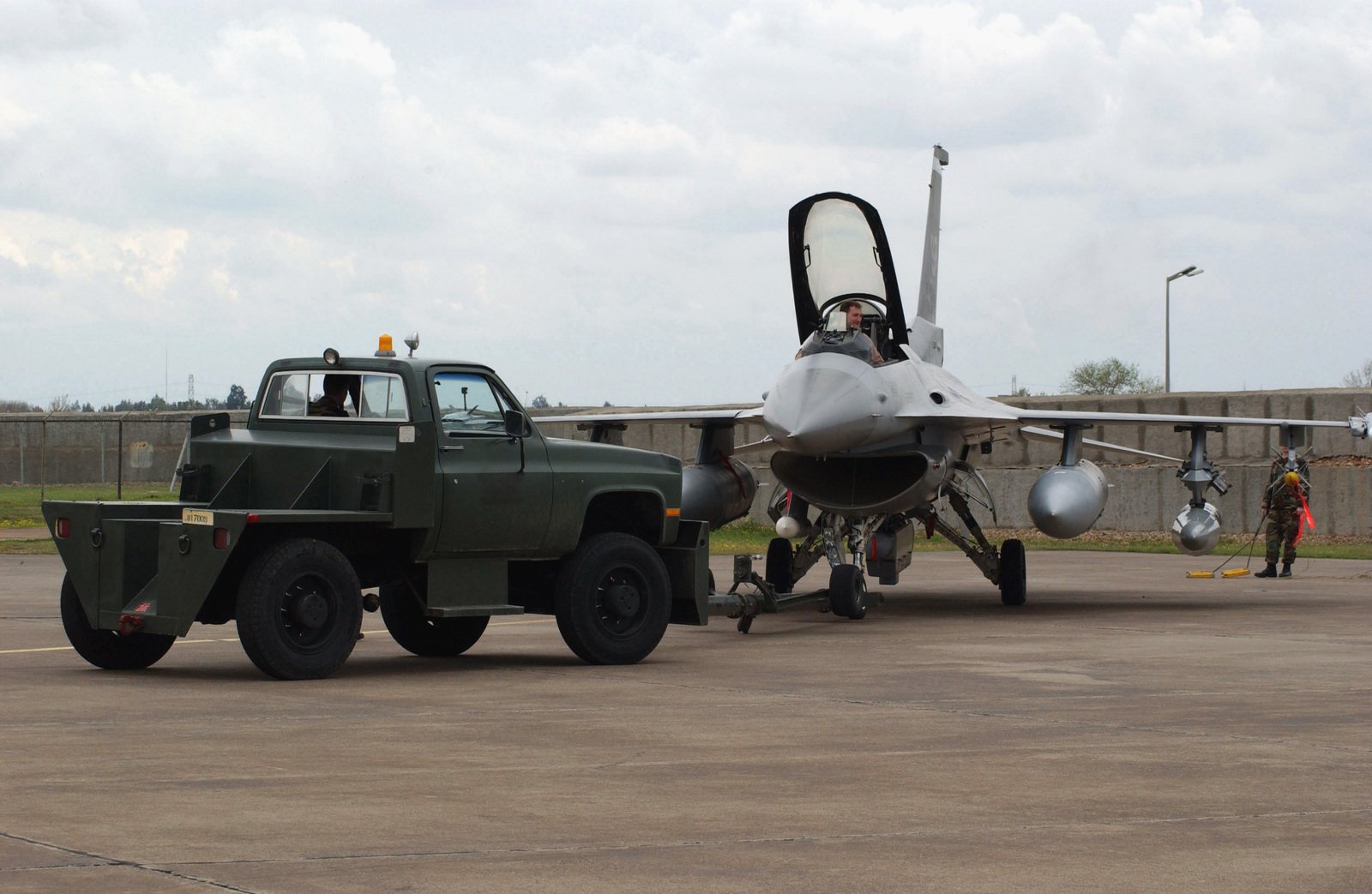 US Air Force (USAF) Ground Crew Personnel Use A Bobtailed Aircraft Tow ...