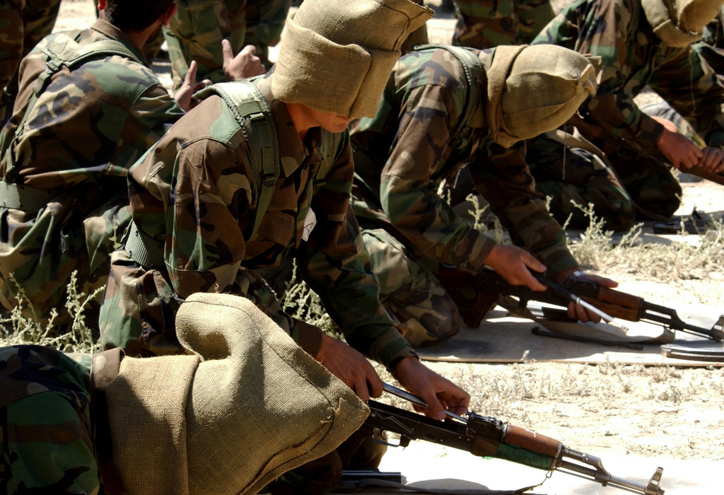 Afghanistan National Army (ANA) Soldiers practice assembling their