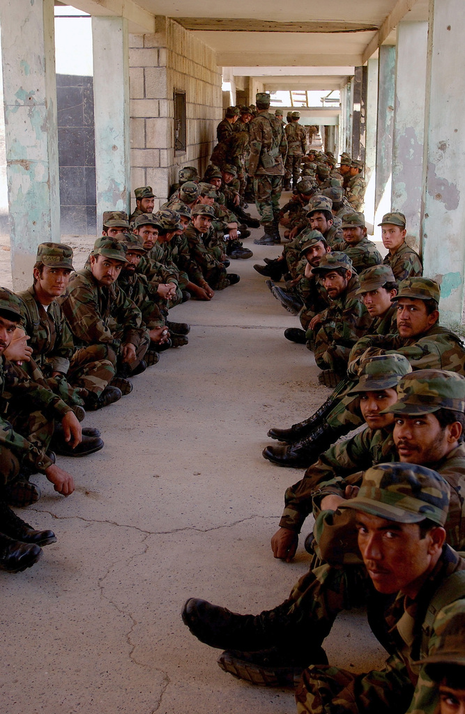 New recruits in the Afghanistan National Army (ANA) wait in line