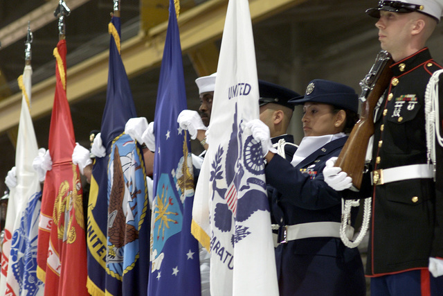 Members of a joint-service color guard post the colors during an Air ...