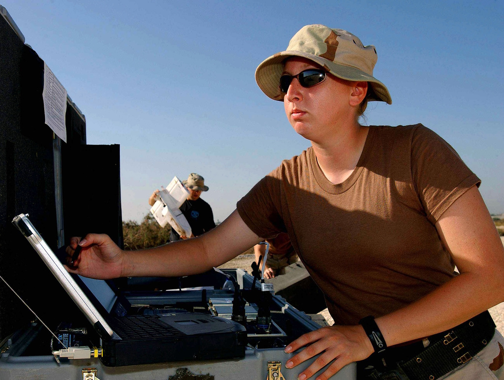 US Air Force (USAF) SENIOR AIRMAN (SRA) Amy Hodges, Airborne Surveillance  Radar System Technician assigned to the 438th Expeditionary Force  Protection Squadron (EFPS) waits for final Global Positioning Systems (GPS)  data before