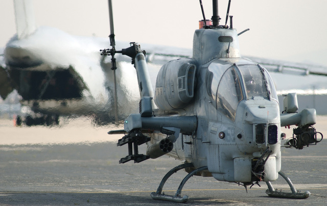 A US Marine Corps (USMC) AH-1W Super Cobra helicopter assigned to ...