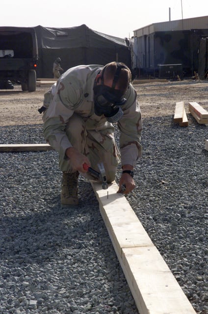 Gunnery Sergeant (gysgt) Michael Lund Constructs Tents During A Gas 