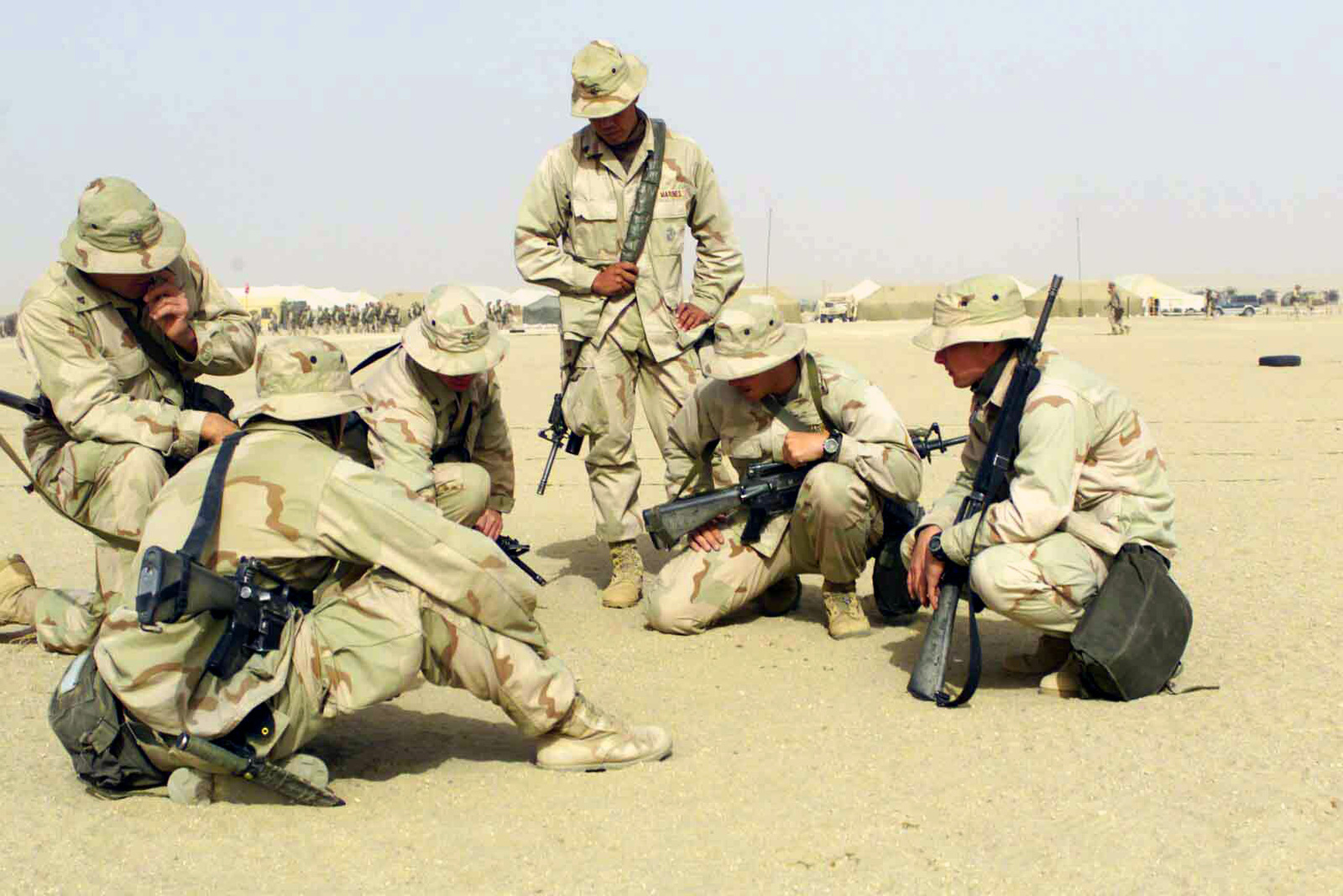 A Us Marine Corps Usmc Squad Leader Discusses Proper Dispersion Distance And Techniques With Other Personnel During Patrol Training At Camp Ripper Kuwait In Support Of Operation Enduring Freedom U S National