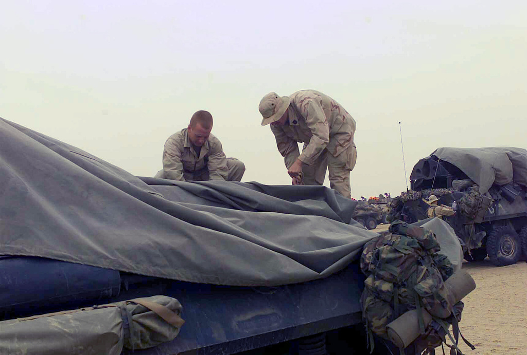 US Marine Corps (USMC) Lance Corporal (LCPL) Eric Bonnema and US Navy ...