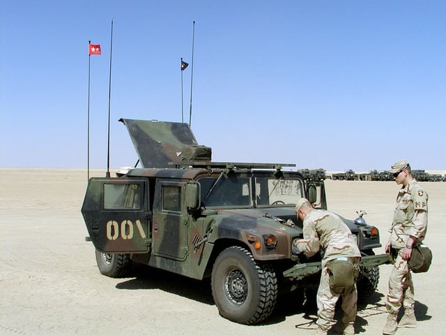 A US Army (USA) Soldier performs preventive maintenance checks and ...