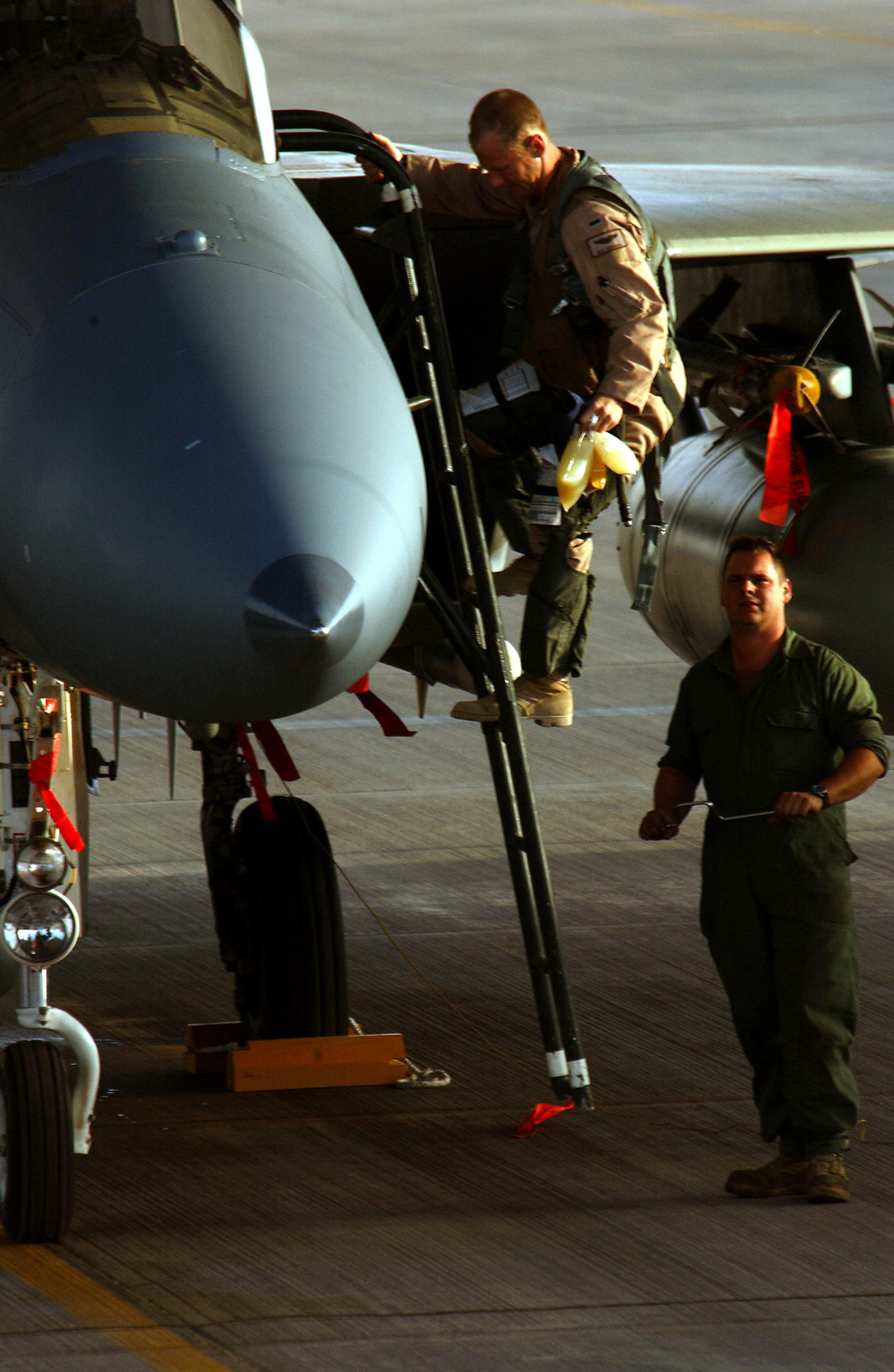 A US Air Force (USAF) pilot exits his USAF F-15C Eagle aircraft after a ...