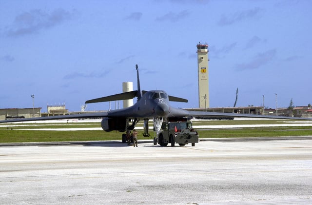 A US Air Force (USAF) ground crew uses an MB-2 aircraft tow tractor to ...