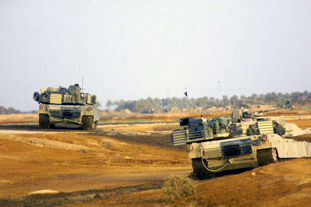 US Marine Corps (USMC) personnel in M1A1 Abrams Main Battle Tanks (MBT ...