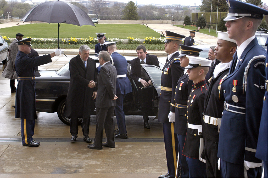 U.S. Secretary of Defense, Donald H. Rumsfeld greets and shakes hands ...