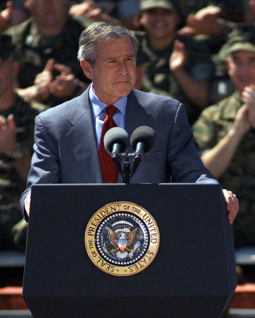 President George W. Bush talks with members of the Tampa Bay Buccaneers  during his visit to