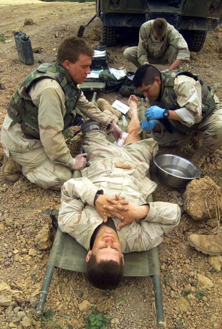 A Us Navy (usn) Hospital Corpsman Assigned To 3rd Battalion, 1st Marine 