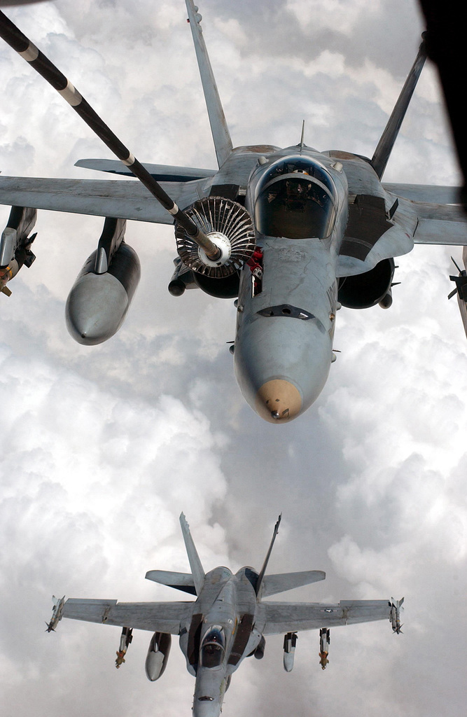 Two US Navy (USN) F/A-18C Hornet aircraft assigned to Strike Fighter ...