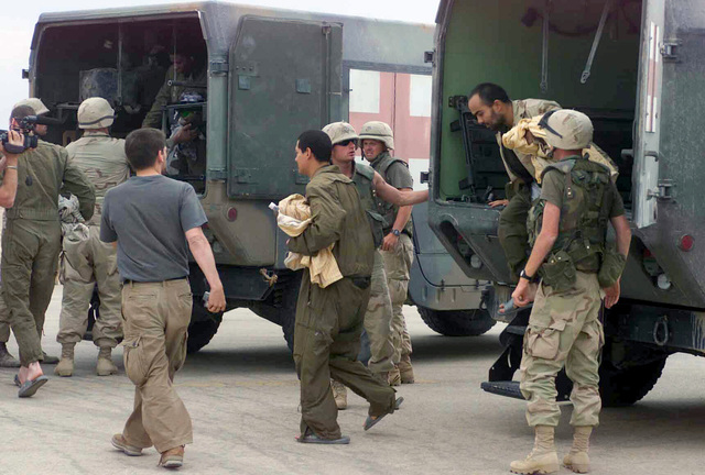 US Army (USA) Specialists (SPC) Edgar Hernandez (center) and USA SPC ...