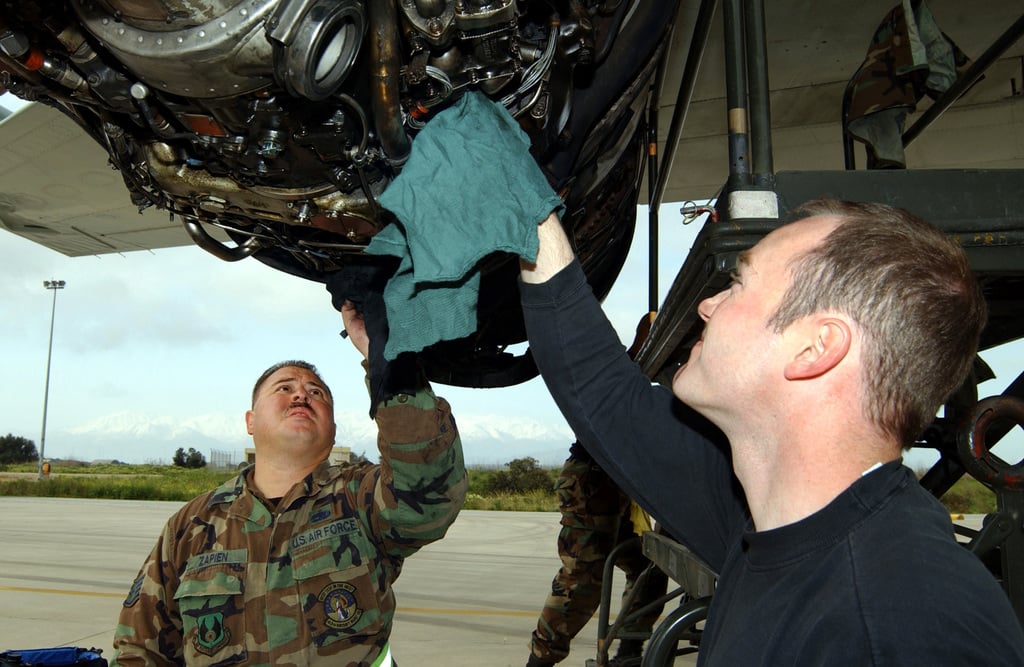 US Air Force (USAF) STAFF Sergeant (SSGT) James Zapien (rear) and USAF ...