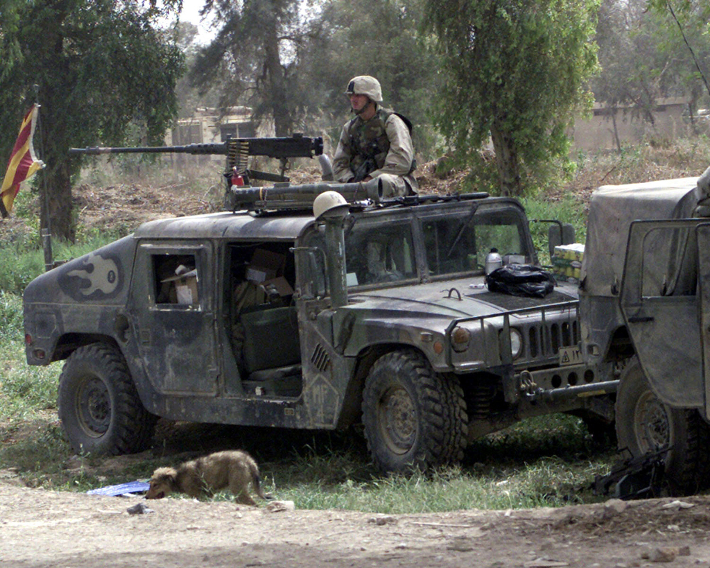 Armed With An M2 50 Caliber Machine Gun Mounted On A High Mobility Multipurpose Wheeled Vehicle