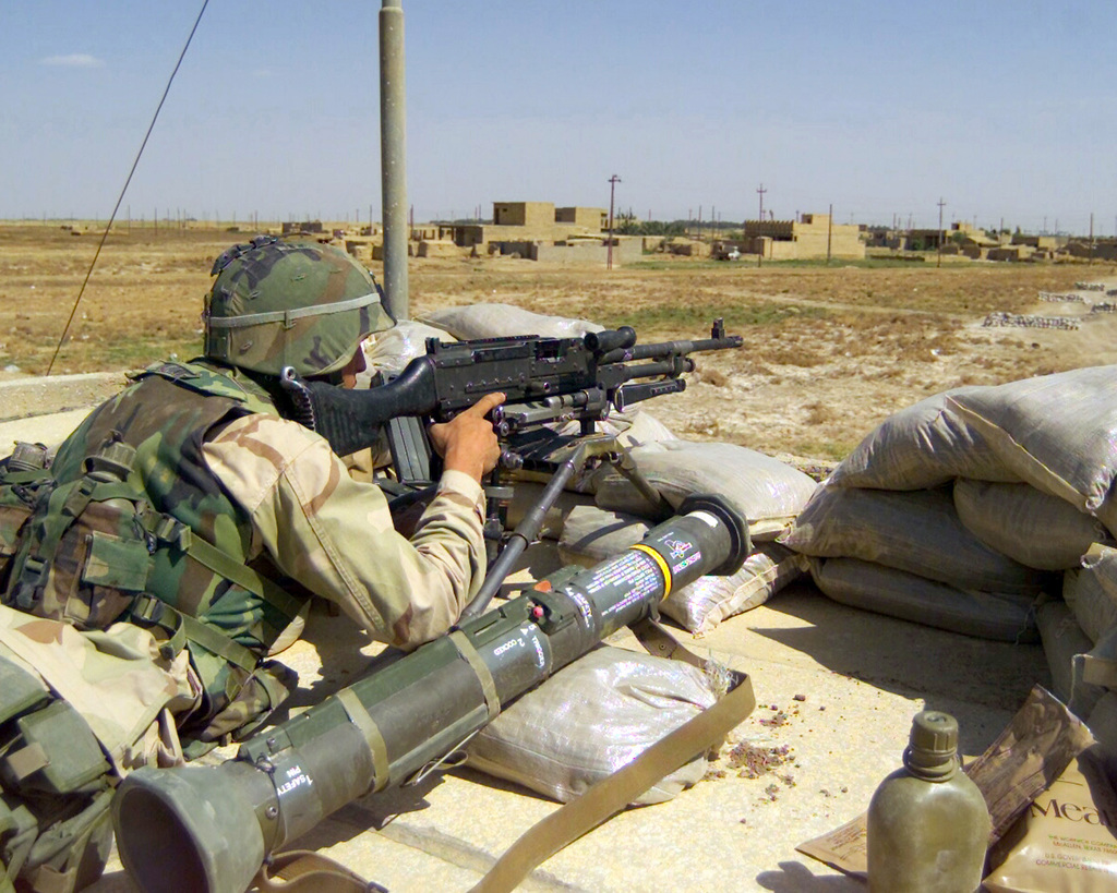 With an M136 AT4 light anti-tank recoilless rifle by his side, Sergeant ...