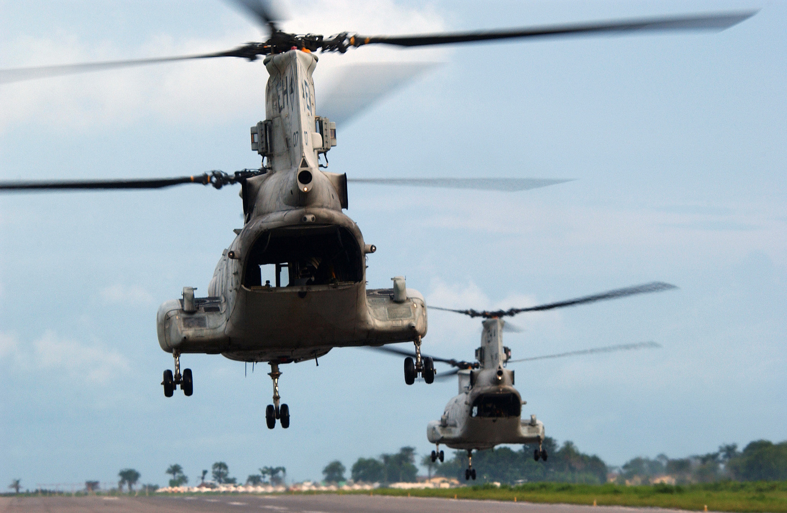 Two US Marine Corps (USMC) CH-46E Sea Knight helicopter assigned to ...