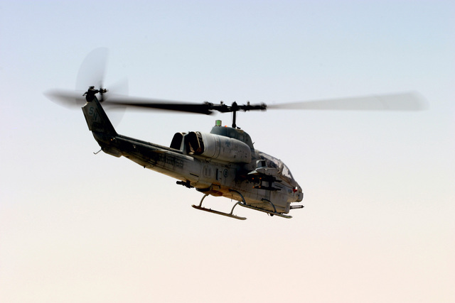 A US Marine Corps (USMC) AH-1W Super Cobra helicopter assigned to ...